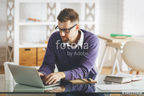 Thoughtful european business man working on project